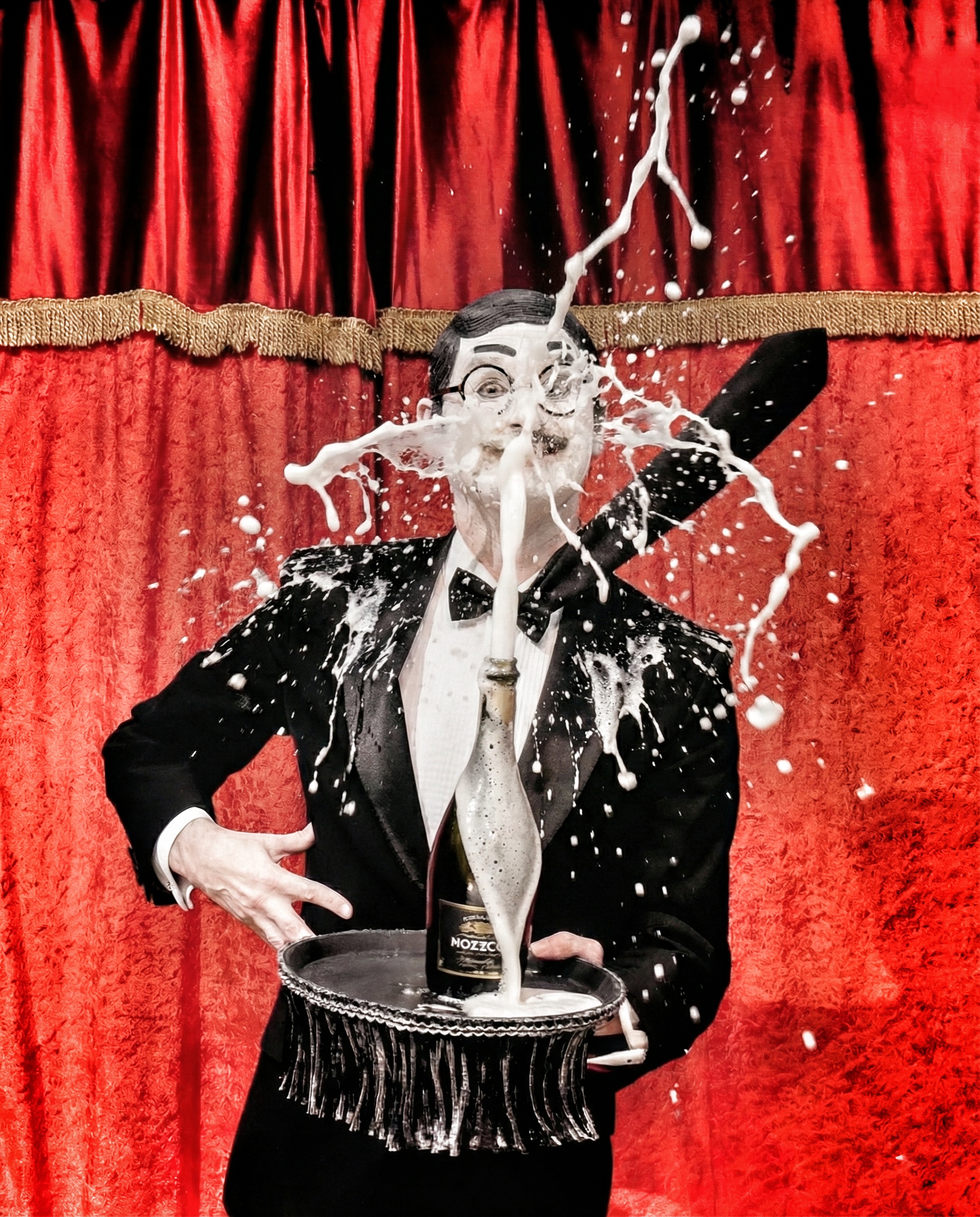 Enrico Touché pops a champagne cork and the champagne sprays all over their face